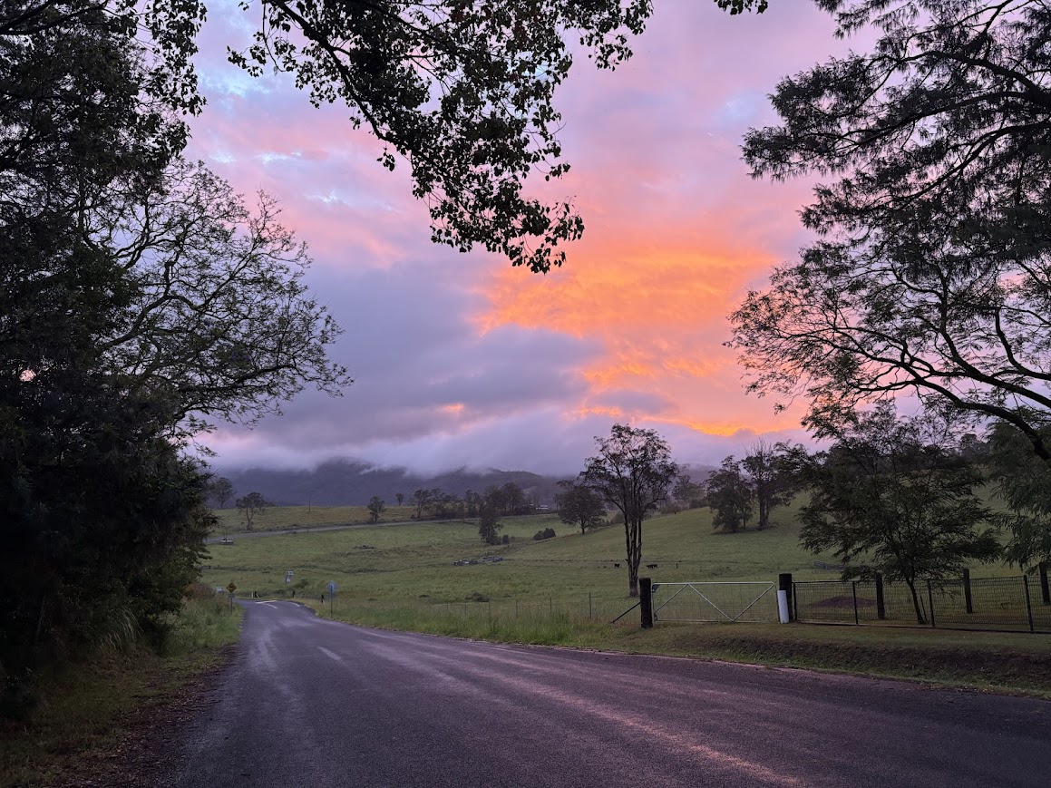 country road after rain at sunset
